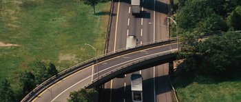 Movie still from “The Guilt Trip” (2012), directed by Anne Fletcher – An aerial view of a highway with cars driving on it; Extreme Wide shot, Overhead angle