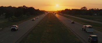 Movie still from “The Guilt Trip” (2012), directed by Anne Fletcher – An image of a sunset on a highway; Extreme Wide shot, High angle