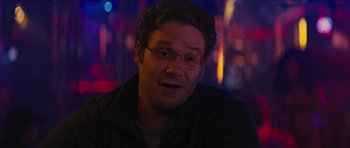 Movie still from “The Guilt Trip” (2012), directed by Anne Fletcher – A person wearing glasses and a jacket; Close Up shot, Over the shoulder angle
