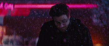 Movie still from “The Guilt Trip” (2012), directed by Anne Fletcher – A man with glasses is looking down at the snow; Close Up shot, Over the shoulder angle