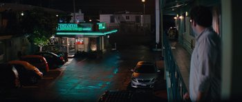 Movie still from “The Guilt Trip” (2012), directed by Anne Fletcher – A car parked on the side of the road at night; Extreme Wide shot, High angle
