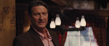 Movie still from “The Guilt Trip” (2012), directed by Anne Fletcher – A person wearing a suit and tie; Close Up shot, Over the shoulder angle