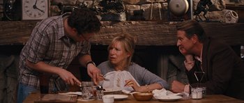 Movie still from “The Guilt Trip” (2012), directed by Anne Fletcher – A woman sitting at a dinner table with a man; Medium shot, Over the shoulder angle