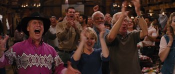 Movie still from “The Guilt Trip” (2012), directed by Anne Fletcher – A group of people standing in front of a crowd; Medium shot, Low angle