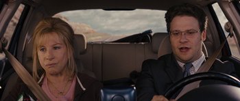 Movie still from “The Guilt Trip” (2012), directed by Anne Fletcher – A man and a woman sitting in the back of a car; Close Up shot, Over the shoulder angle