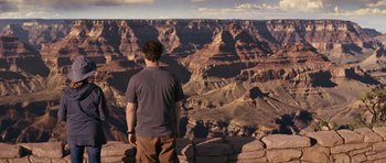 Movie still from “The Guilt Trip” (2012), directed by Anne Fletcher – A man standing on top of a cliff looking at a canyon; Extreme Wide shot, High angle