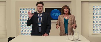 Movie still from “The Guilt Trip” (2012), directed by Anne Fletcher – A man and a woman standing in front of a counter; Medium shot, Over the shoulder angle