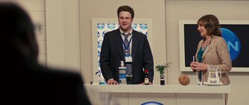 Movie still from “The Guilt Trip” (2012), directed by Anne Fletcher – A man standing in front of a microphone; Medium shot, Over the shoulder angle