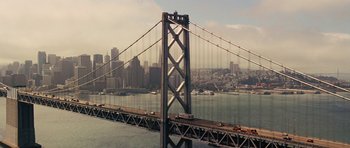 Movie still from “The Guilt Trip” (2012), directed by Anne Fletcher – A view of a bridge with a city in the background; Extreme Wide shot, High angle