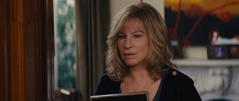 Movie still from “The Guilt Trip” (2012), directed by Anne Fletcher – A person holding a book; Close Up shot, Over the shoulder angle