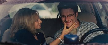 Movie still from “The Guilt Trip” (2012), directed by Anne Fletcher – A man and a woman in the back of a car; Close Up shot, Over the shoulder angle