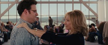 Movie still from “The Guilt Trip” (2012), directed by Anne Fletcher – A man and a woman are looking at each other in an airport; Medium shot, Over the shoulder angle
