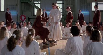 Movie still from “The Handmaid's Tale” (1990), directed by Volker Schlöndorff – A group of people sitting in a room; Wide shot, High angle