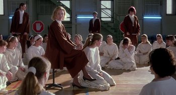 Movie still from “The Handmaid's Tale” (1990), directed by Volker Schlöndorff – A group of young people sitting on the floor; Wide shot, High angle