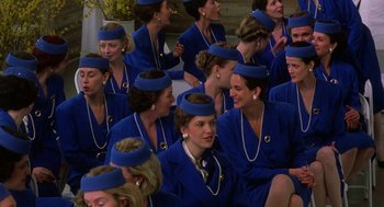 Movie still from “The Handmaid's Tale” (1990), directed by Volker Schlöndorff – A group of women wearing blue hats sitting next to each other; Medium shot, High angle