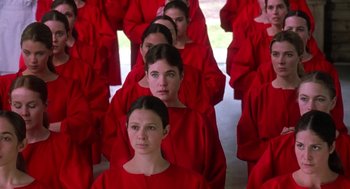 Movie still from “The Handmaid's Tale” (1990), directed by Volker Schlöndorff – A group of women in red robes standing in a line; Medium shot, High angle