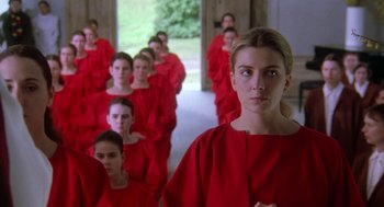 Movie still from “The Handmaid's Tale” (1990), directed by Volker Schlöndorff – A group of women in red robes standing in a hallway; Medium shot, High angle