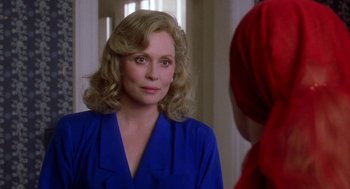 Movie still from “The Handmaid's Tale” (1990), directed by Volker Schlöndorff – A woman in a blue dress looking at a mirror; Close Up shot, Over the shoulder angle