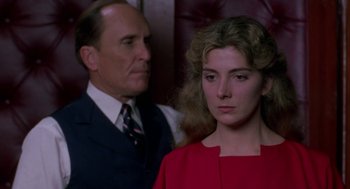 Movie still from “The Handmaid's Tale” (1990), directed by Volker Schlöndorff – A man and a woman standing next to each other; Close Up shot, Over the shoulder angle