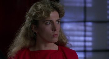 Movie still from “The Handmaid's Tale” (1990), directed by Volker Schlöndorff – A person wearing a red shirt; Close Up shot, Over the shoulder angle