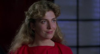 Movie still from “The Handmaid's Tale” (1990), directed by Volker Schlöndorff – A person wearing a red shirt; Close Up shot, Low angle