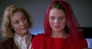 Movie still from “The Handmaid's Tale” (1990), directed by Volker Schlöndorff – A woman in a red dress and a woman in a white dress; Close Up shot, Over the shoulder angle