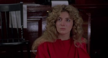 Movie still from “The Handmaid's Tale” (1990), directed by Volker Schlöndorff – A woman with long blonde hair wearing a red shirt; Close Up shot, Over the shoulder angle