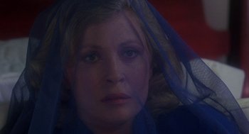 Movie still from “The Handmaid's Tale” (1990), directed by Volker Schlöndorff – A person wearing a veil; Close Up shot, High angle