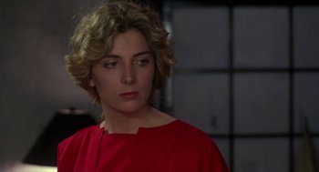 Movie still from “The Handmaid's Tale” (1990), directed by Volker Schlöndorff – A person wearing a red shirt; Close Up shot, Over the shoulder angle
