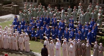 Movie still from “The Handmaid's Tale” (1990), directed by Volker Schlöndorff – A large group of people standing on bleachers; Extreme Wide shot, High angle