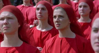 Movie still from “The Handmaid's Tale” (1990), directed by Volker Schlöndorff – A group of women in red robes and red hats; Close Up shot, High angle