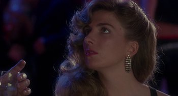 Movie still from “The Handmaid's Tale” (1990), directed by Volker Schlöndorff – A beautiful woman with long hair wearing a dress and earrings; Close Up shot, Low angle