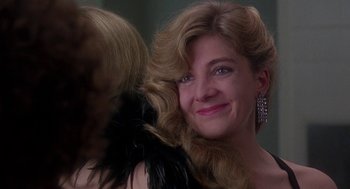 Movie still from “The Handmaid's Tale” (1990), directed by Volker Schlöndorff – A person wearing a dress; Close Up shot, Over the shoulder angle