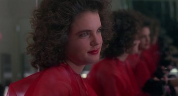 Movie still from “The Handmaid's Tale” (1990), directed by Volker Schlöndorff – A person wearing a red shirt; Close Up shot, Over the shoulder angle
