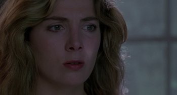 Movie still from “The Handmaid's Tale” (1990), directed by Volker Schlöndorff – A woman's face in the dark; Close Up shot, Low angle