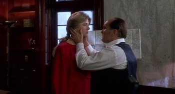 Movie still from “The Handmaid's Tale” (1990), directed by Volker Schlöndorff – A man and a woman in front of a window; Medium shot, Over the shoulder angle