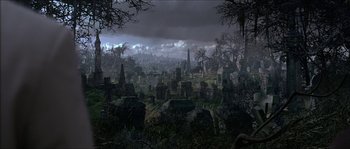 Movie still from “The Haunted Mansion” (2003), directed by Rob Minkoff – An image of a graveyard with a cloudy sky in the background; Extreme Wide shot, High angle