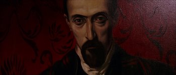 Movie still from “The Haunted Mansion” (2003), directed by Rob Minkoff – A painting of a man with a beard and mustache; Extreme Close Up shot, Low angle