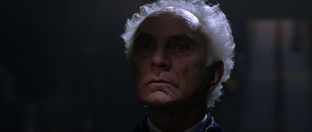 Movie still from “The Haunted Mansion” (2003), directed by Rob Minkoff – An old man with a white wig on his head; Close Up shot, Low angle