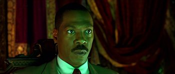 Movie still from “The Haunted Mansion” (2003), directed by Rob Minkoff – A person wearing a suit and tie; Close Up shot, Low angle