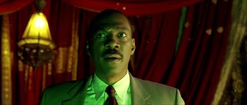 Movie still from “The Haunted Mansion” (2003), directed by Rob Minkoff – A person wearing a suit and tie; Close Up shot, Low angle