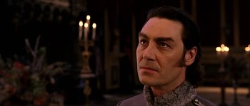 Movie still from “The Haunted Mansion” (2003), directed by Rob Minkoff – A person with a candle in the background; Close Up shot, Low angle