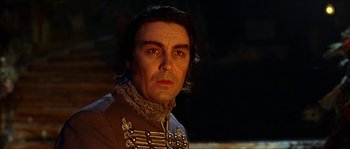 Movie still from “The Haunted Mansion” (2003), directed by Rob Minkoff – A person wearing a uniform; Close Up shot, Low angle