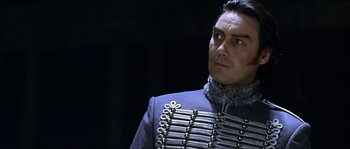 Movie still from “The Haunted Mansion” (2003), directed by Rob Minkoff – A person wearing a uniform; Close Up shot, Over the shoulder angle