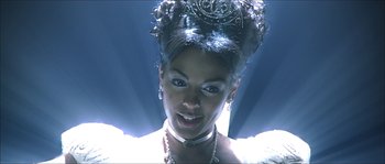 Movie still from “The Haunted Mansion” (2003), directed by Rob Minkoff – A person wearing a necklace; Close Up shot, Low angle