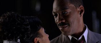 Movie still from “The Haunted Mansion” (2003), directed by Rob Minkoff – A man and a woman looking at one another; Close Up shot, Over the shoulder angle