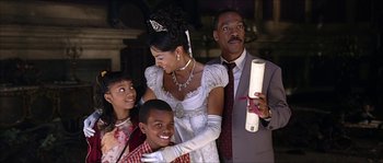 Movie still from “The Haunted Mansion” (2003), directed by Rob Minkoff – A man and a woman with two children; Medium shot, Over the shoulder angle