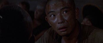 Movie still from “The Hawaiians” (1970), directed by Tom Gries – A person looking at the camera; Close Up shot, Over the shoulder angle