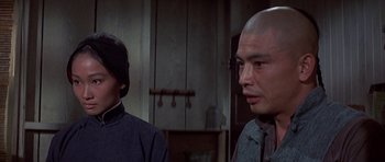 Movie still from “The Hawaiians” (1970), directed by Tom Gries – A man with a blindfold and a man with a bald head; Close Up shot, Low angle