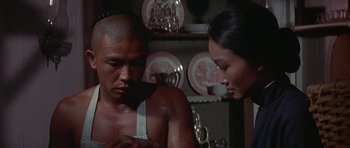 Movie still from “The Hawaiians” (1970), directed by Tom Gries – A man and a woman looking at one another; Close Up shot, Low angle